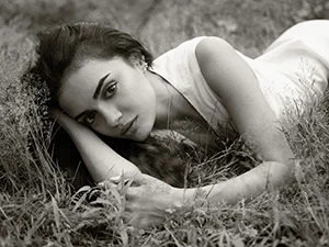sepia portrait woman lying grass Armani fashion