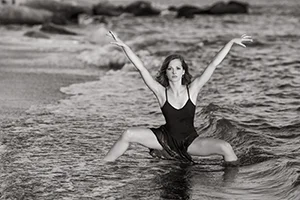 dance pose woman in surf bw